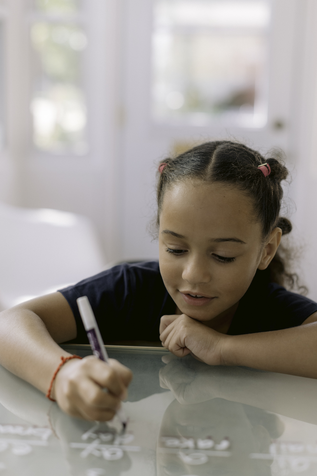 A learner writing during a focused Clubhouse tutoring session